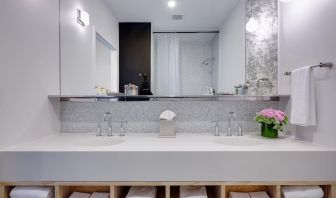Private guest bathroom with shower and free toiletries at Nu Hotel - Brooklyn.