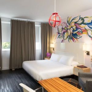 King bed with workspace and private bathroom at Nu Hotel - Brooklyn.