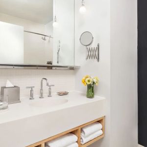 Private guest bathroom with shower and free toiletries at Nu Hotel - Brooklyn.