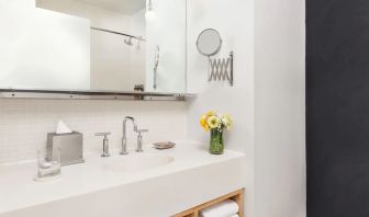 Private guest bathroom with shower and free toiletries at Nu Hotel - Brooklyn.