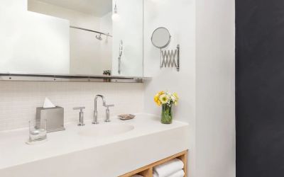 Private guest bathroom with shower and free toiletries at Nu Hotel - Brooklyn.