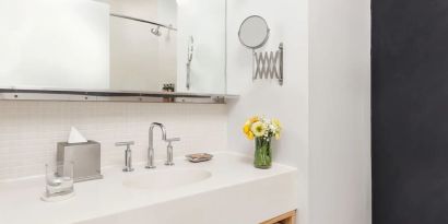 Private guest bathroom with shower and free toiletries at Nu Hotel - Brooklyn.