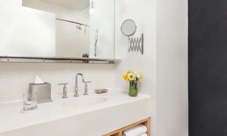 Private guest bathroom with shower and free toiletries at Nu Hotel - Brooklyn.