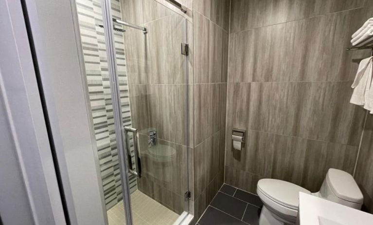 Private bathroom with shower at King Hotel Brooklyn.