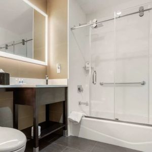 Private guest bathroom with free toiletries at Comfort Inn Prospect Park-Brooklyn.