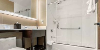 Private guest bathroom with free toiletries at Comfort Inn Prospect Park-Brooklyn.