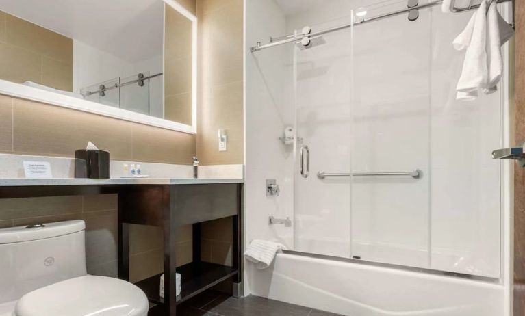 Private guest bathroom with free toiletries at Comfort Inn Prospect Park-Brooklyn.
