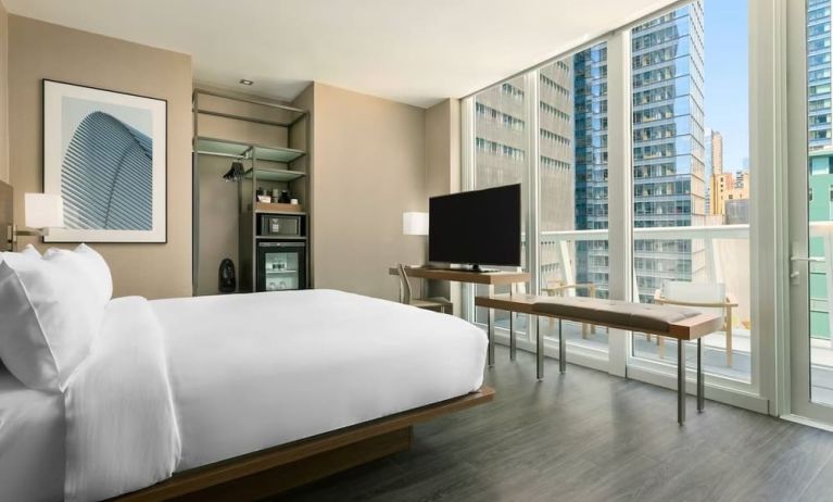 Day use room with work desk, balcony and private bathroom at AC Hotel New York Times Square.