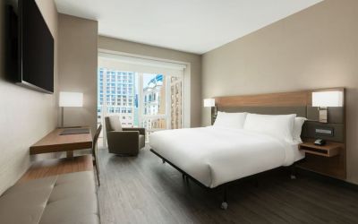Day use room with workspace, large windows and private bathroom at AC Hotel New York Times Square.