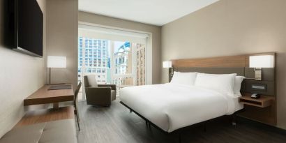 Day use room with workspace, large windows and private bathroom at AC Hotel New York Times Square.
