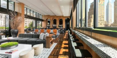 Lounge area with comfortable seating, perfect for coworking at AC Hotel New York Times Square.