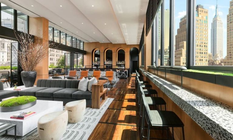 Lounge area with comfortable seating, perfect for coworking at AC Hotel New York Times Square.