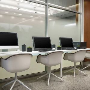 Business center with cmputers, printer and ergonomic chairs at AC Hotel New York Times Square.