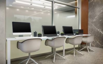 Business center with cmputers, printer and ergonomic chairs at AC Hotel New York Times Square.