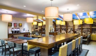 On-site restaurant with comfortable seating, perfect as workspace at Hampton Inn Manhattan - Madison Square Garden.