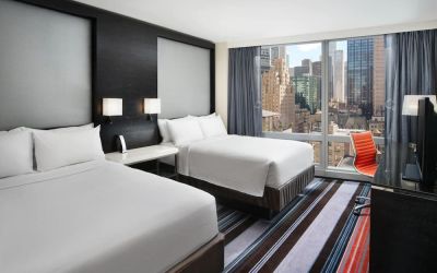 Day use twin room with work desk and floor to ceiling window at Courtyard By Marriott New York Manhattan/Central Park.