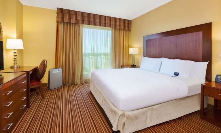 Day use room with work desk and natural light at Embassy Suites By Hilton Charlotte-Concord-Golf Resort & Spa.