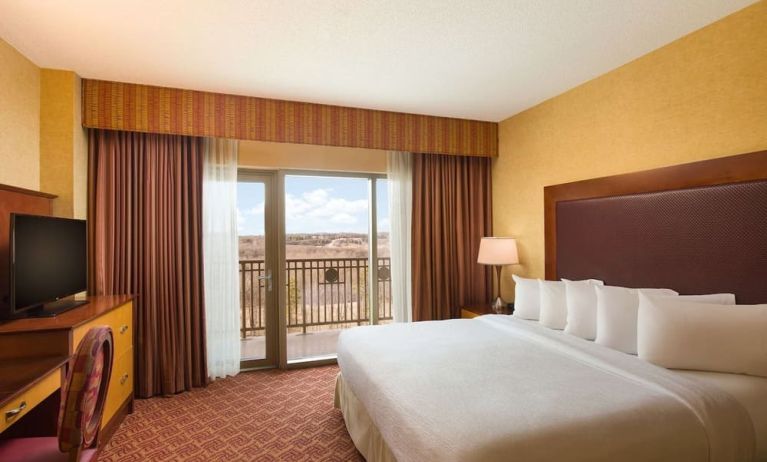 Day use room with balcony and work desk at Embassy Suites By Hilton Charlotte-Concord-Golf Resort & Spa.