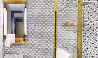 Private guest bathroom with shower and free toiletries at Hotel Shocard NYC.