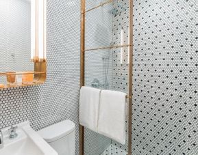 Private guest bathroom with shower at Hotel Shocard NYC.