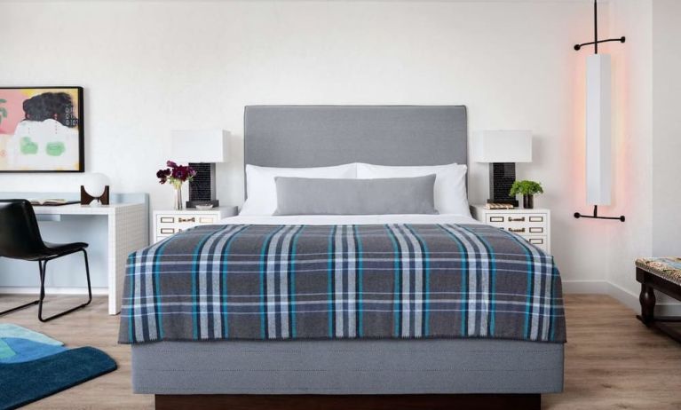 Day use room with king bed and work desk at Graduate New York.