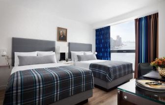 Day use twin room with work desk and private bathroom at Graduate New York.