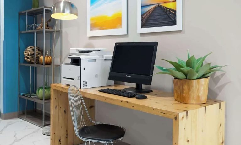 Business center with computer and printer at Days Inn By Wyndham Staten Island.