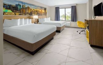 Day use twin room with work desk and private bathroom at Days Inn By Wyndham Staten Island.