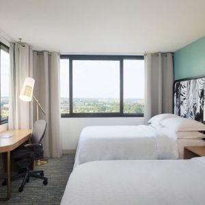 Day use twin room with work desk and private bathroom at Sheraton Miami Airport Hotel.