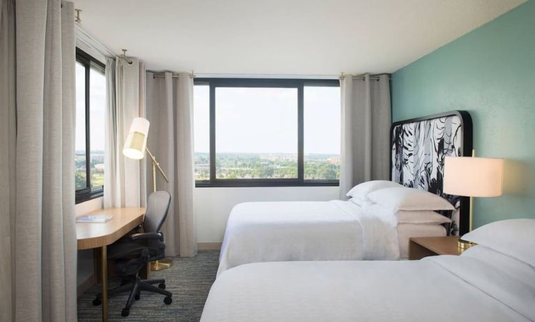 Day use twin room with work desk and private bathroom at Sheraton Miami Airport Hotel.