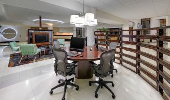 Business center with computers, printer and ergonomic chairs at Sheraton Miami Airport Hotel.