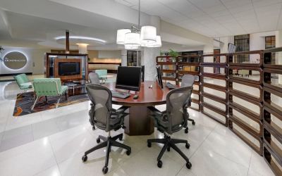 Business center with computers, printer and ergonomic chairs at Sheraton Miami Airport Hotel.
