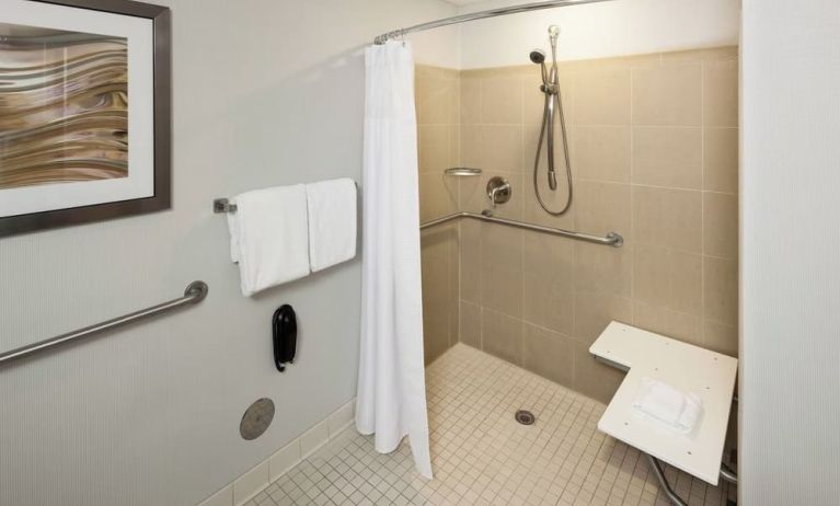 Private guest bathroom with accesible shower and free toiletries at Courtyard Miami Dolphin Mall.