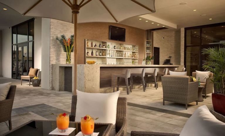 Hotel bar at the terrace with comfortable seating at EB Hotel Miami.