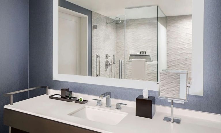 Private guest bathroom with shower and free toiletries at Hyatt Centric Brickell Miami.