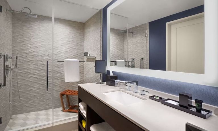 Private guest bathroom with shower and free toiletries at Hyatt Centric Brickell Miami.