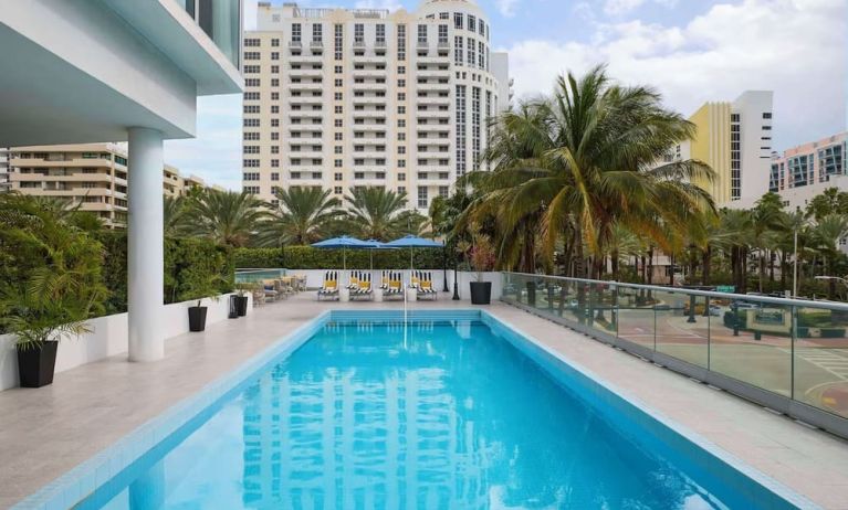 Outdoor pool with lounge seating at Hyatt Centric Miami South Beach.