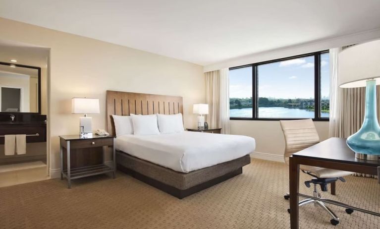 Day use room with large windows, work desk and private bathroom at Hilton Miami Airport Blue Lagoon.