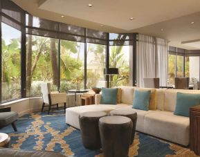 Hotel lobby with comfortable seating and workspace at Hilton Miami Airport Blue Lagoon.