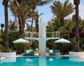 Stylish outdoor pool with lounge chairs at Shelborne South Beach.