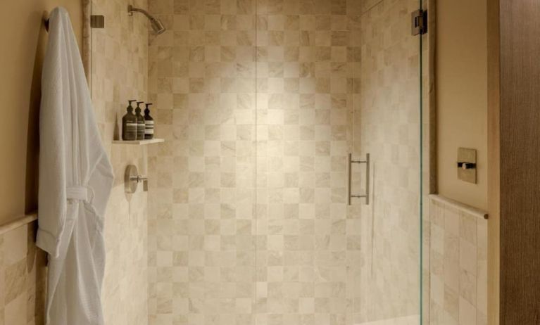 Private guest bathroom with shower and free toiletries at Shelborne South Beach.