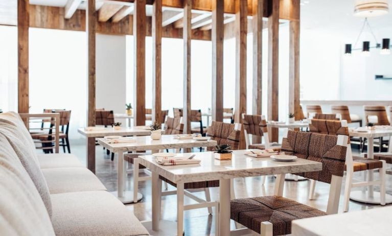 Dining room with comfortable seating, perfect for co-working at Cadillac Hotel & Beach Club, Autograph Collection.