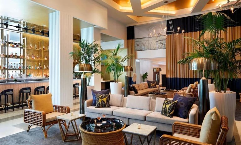Lobby lounge area and workspace, perfect for co-working at Cadillac Hotel & Beach Club, Autograph Collection.