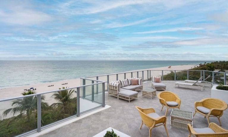 Terrace lounge seating with beautiful view at Cadillac Hotel & Beach Club, Autograph Collection.