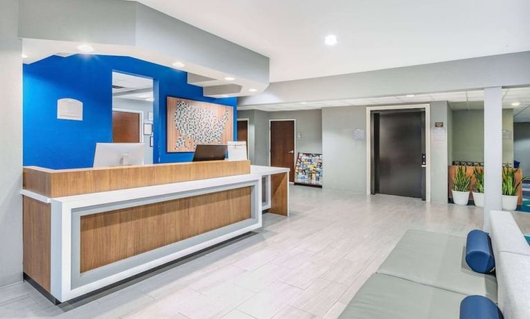 Reception desk at Microtel Inn And Suites By Wyndham Austin Airport.
