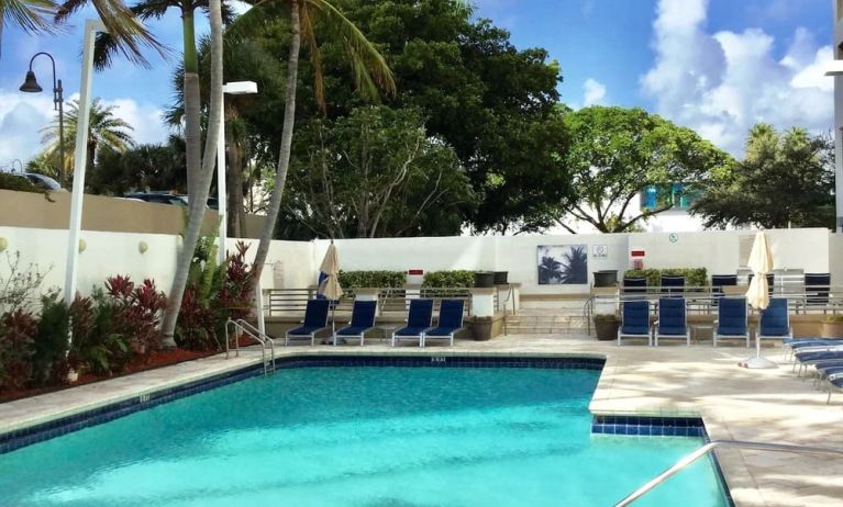 Outdoor pool at GALLERYone - A DoubleTree Suites By Hilton Hotel.