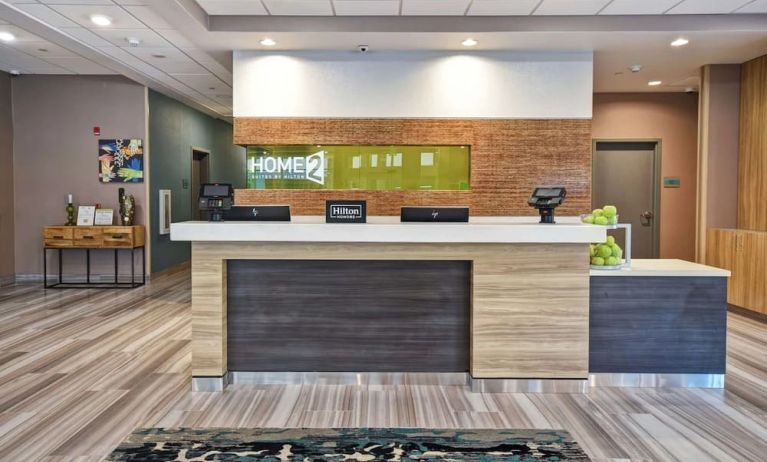 Reception desk at Home2 Suites By Hilton San Francisco Airport North.