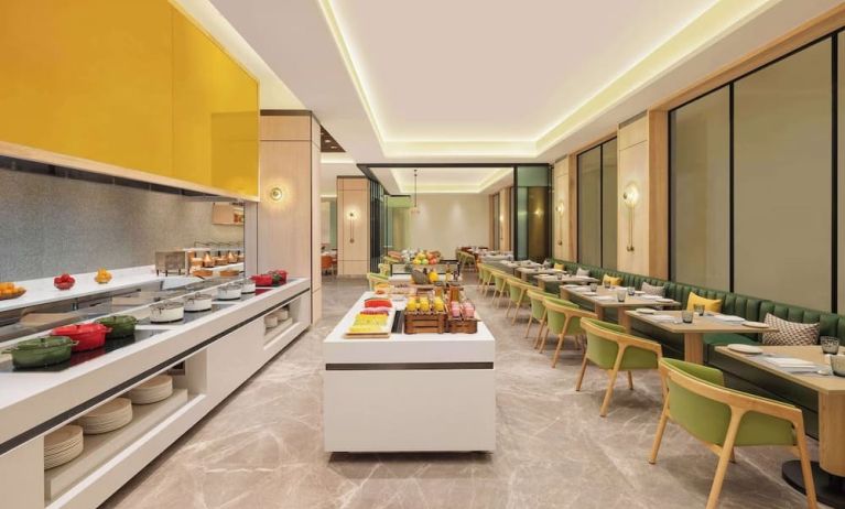 Dining area at Hilton Garden Inn Surat City Centre.