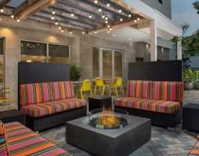 Outdoor seating at Home2 Suites By Hilton Miami Doral West Airport.