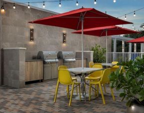 Outdoor seating at Home2 Suites By Hilton Miami Doral West Airport.